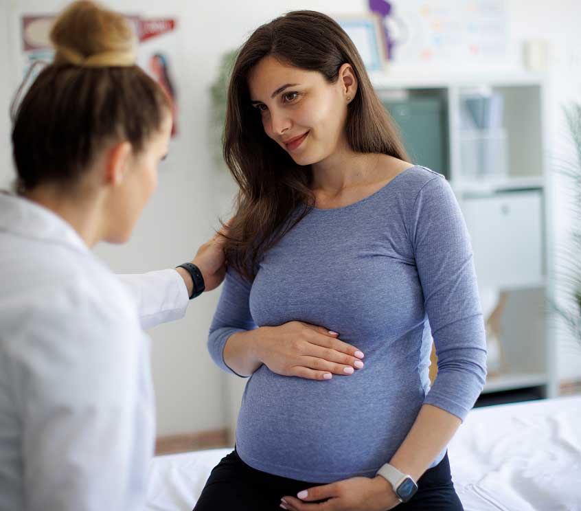 Pregant Woman Speaking with a Doctor