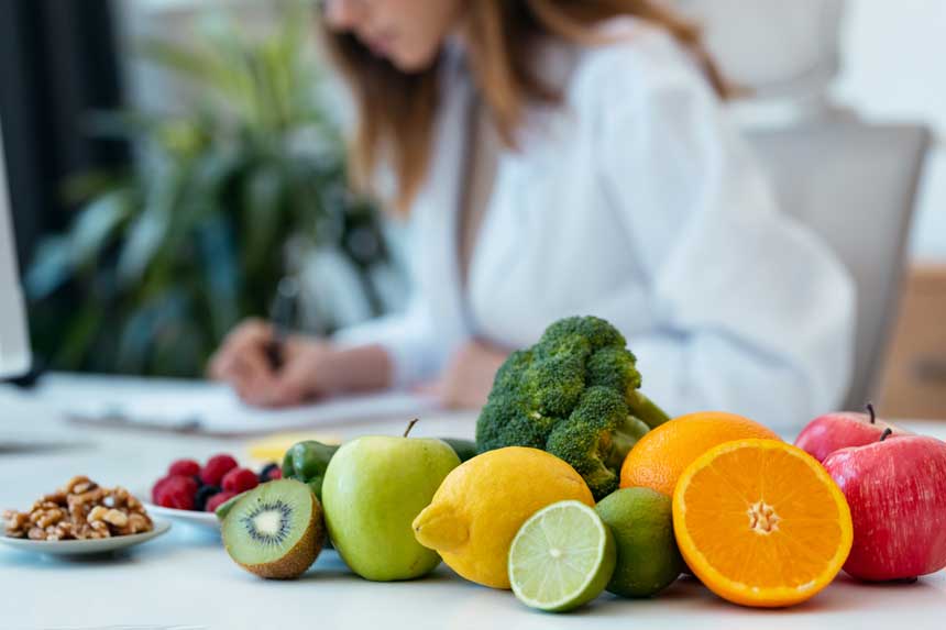Healthy, whole foods on a table in front of the local dietician