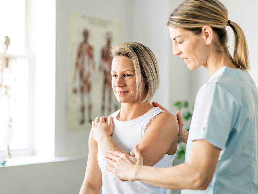 A woman works with a therapist